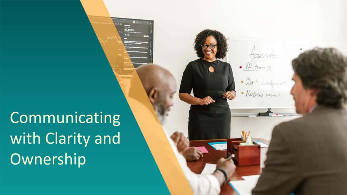 Trainer leading a session on communicating with clarity and ownership in a workplace training course