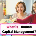 Employees discussing strategy in an office – example of Human Capital Management (HCM) in action